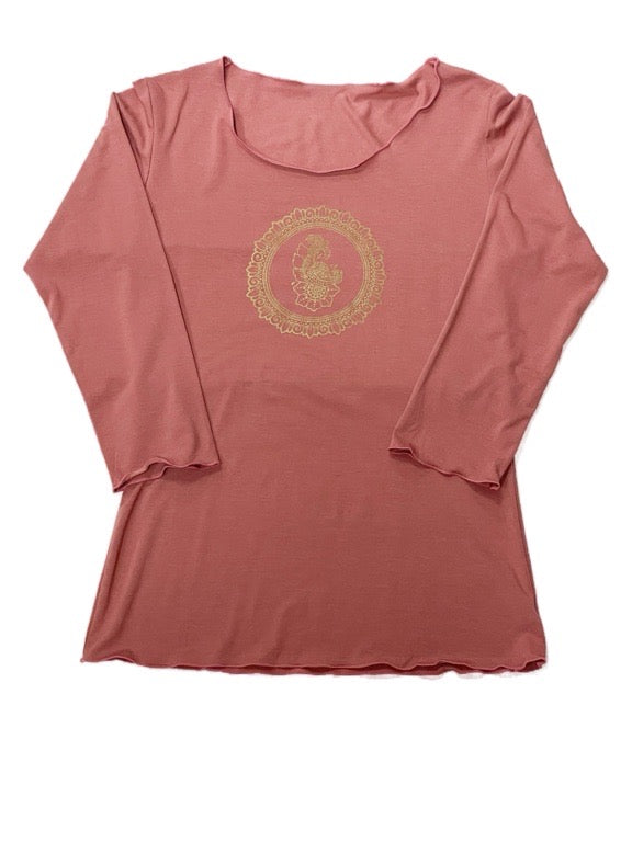 Pink long-sleeve top with a gold emblem on a white background