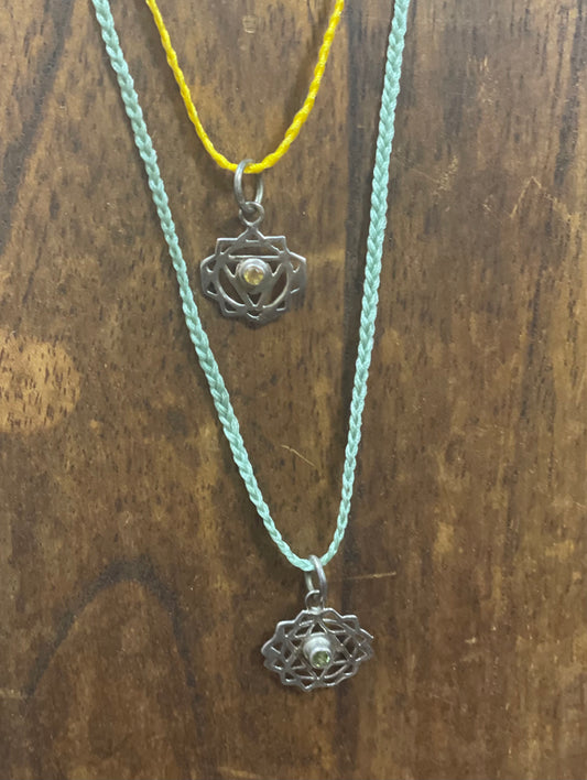 Chakra symbol and crystal necklace