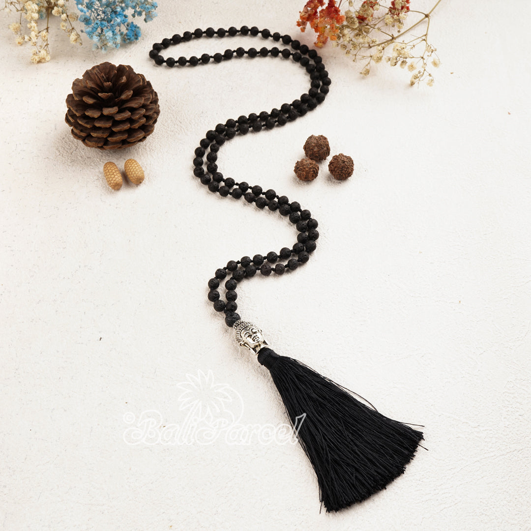 Lava stone with small silver buddha