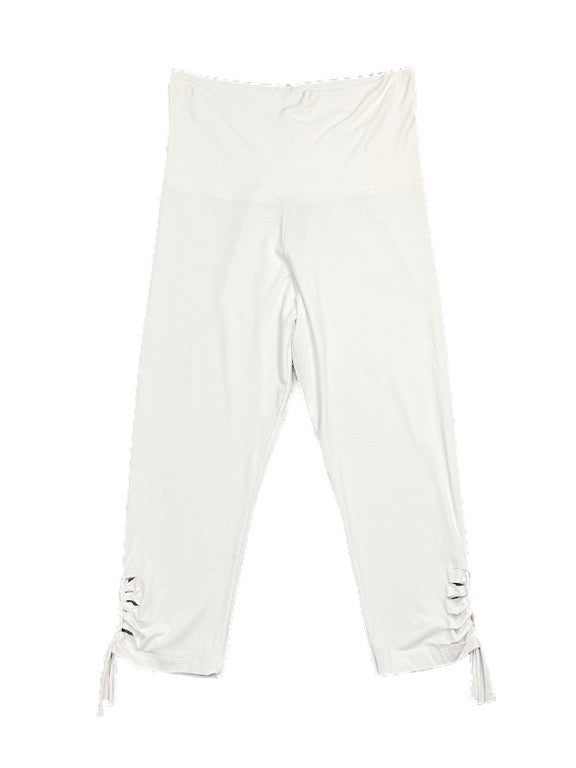 3/4 White leggings with hem detail and buttons.