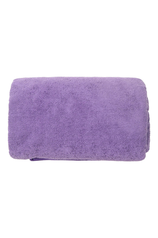 Folded purple towel on a white background