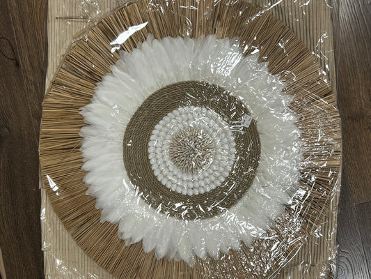 Round wall hanging with cowry, feather & grass