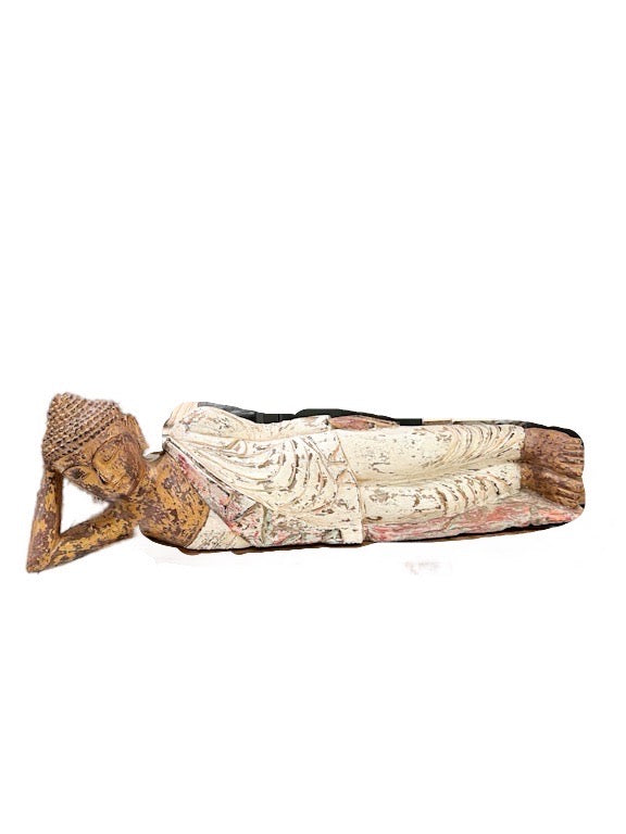 Wooden hand carved Buddha lying down