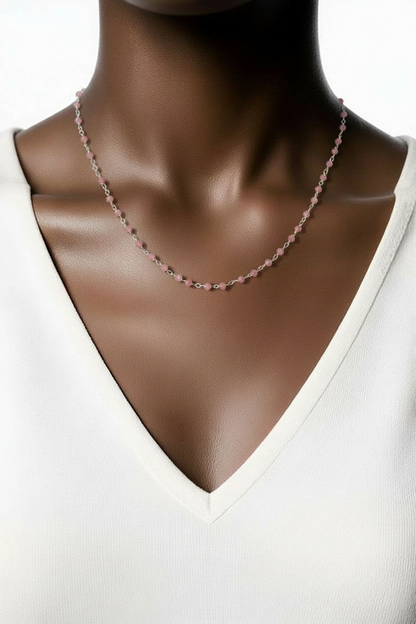 Necklace on a mannequin with a plain background