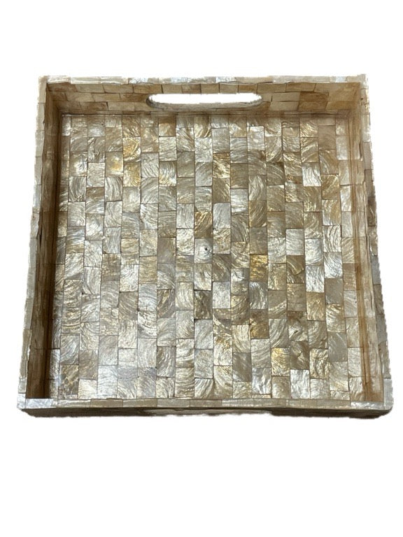 Decorative tray with shell mosaic pattern on a white background