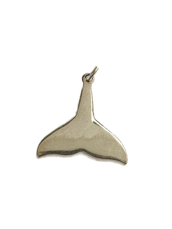 Silver whale tail pendant on a white background