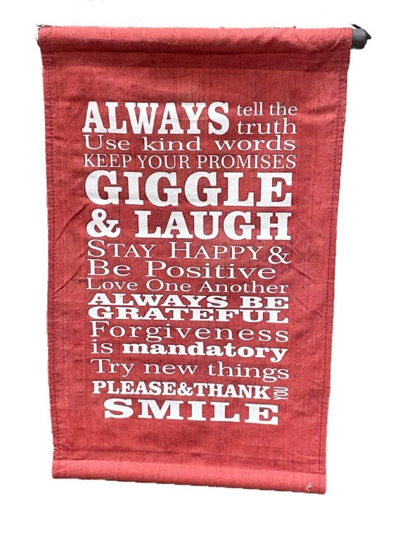 Red fabric banner with white motivational text on a white background