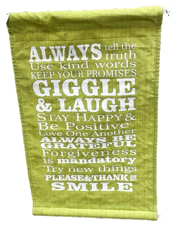 Green towel with motivational text on a white background