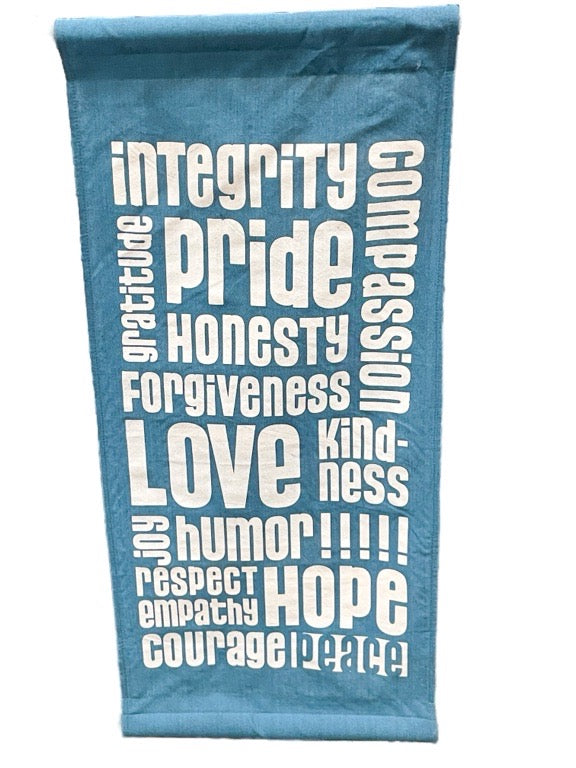 Blue towel with white text on a white background