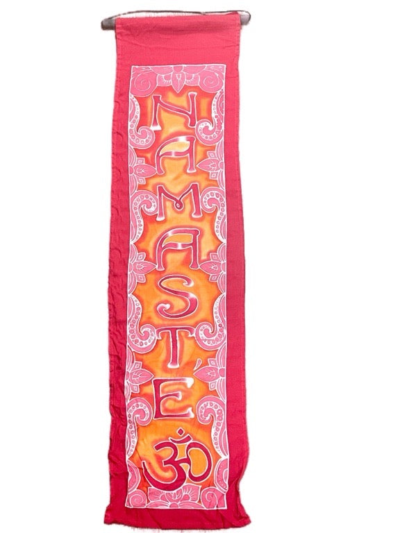 Decorative banner with 'Namaste' and 'Om' symbols on a red background