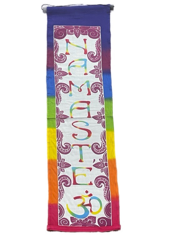 Colorful yoga mat with 'Namaste' and 'Om' symbols on a white background