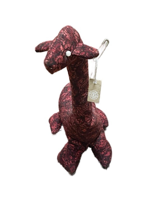 Plush giraffe toy with a tag on a white background