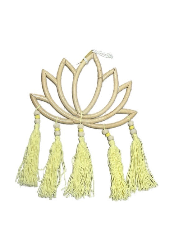 Decorative wall hanging with lotus flower design and tassels on a white background