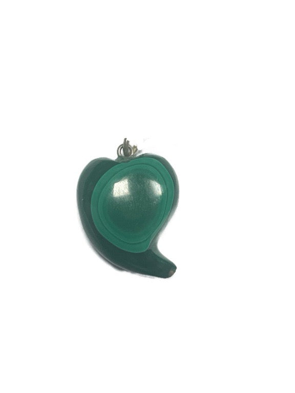 Green pendant shaped like a stylized leaf on a white background