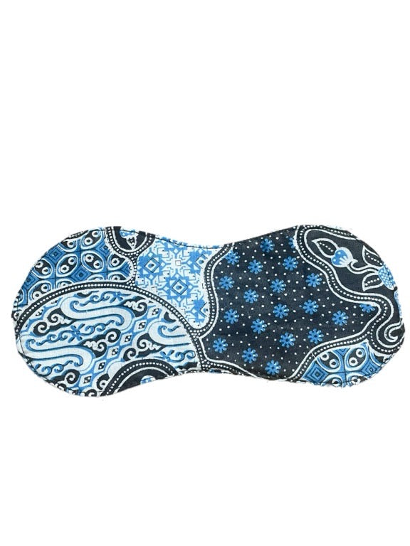 Blue and white patterned eye mask on a white background