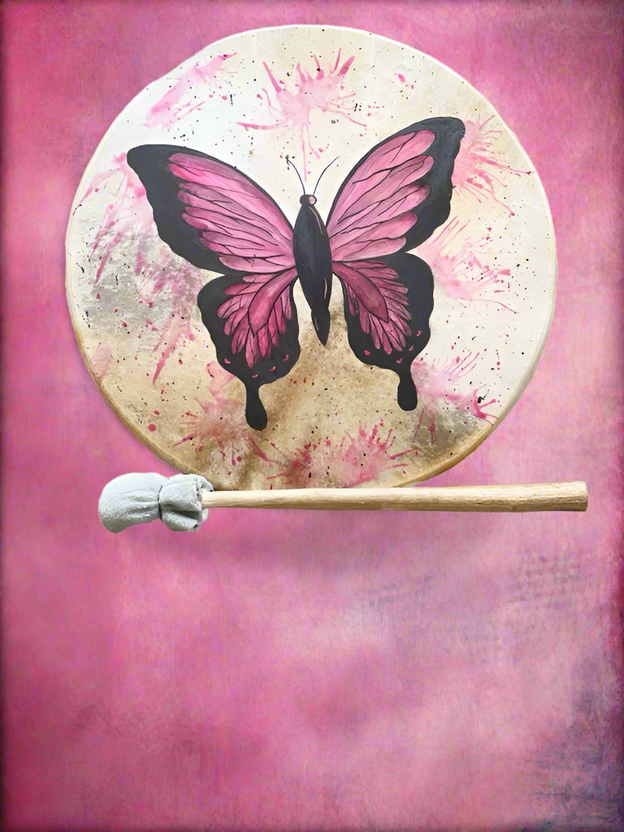 Drum with pink butterfly design and drumstick on a white background