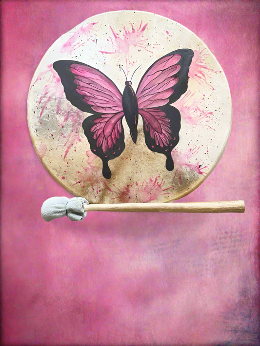 Drum with pink butterfly design and drumstick on a white background