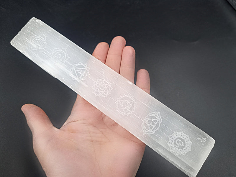 Selenite stick with chakra symbols